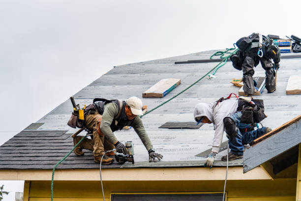 Professional Roof Replacement technician working in Wauregan, CT